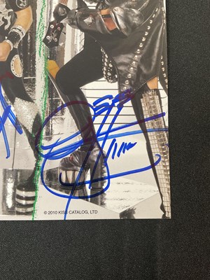 Lot 340 - A KISS 2010 Sonic Boom tour photo card signed...