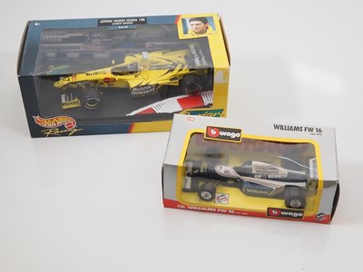 Lot 4 - A pair of diecast 1:18 and 1:24 Formula 1...