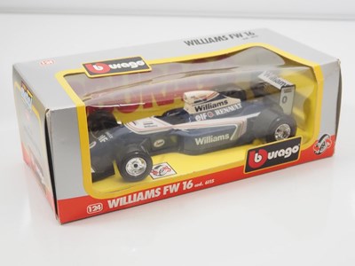Lot 4 - A pair of diecast 1:18 and 1:24 Formula 1...