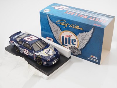 Lot 14 - A group of ACTION RACING COLLECTABLES 1:24...