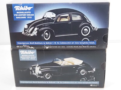 Lot 69 - A group of 1:18 scale diecast cars by TCHIBO,...