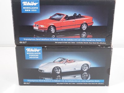 Lot 69 - A group of 1:18 scale diecast cars by TCHIBO,...