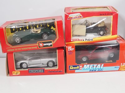 Lot 130 - A group of 1:24 scale diecast cars by BBURAGO,...