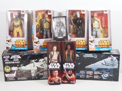 Lot 179 - A group of modern STAR WARS action figures in...