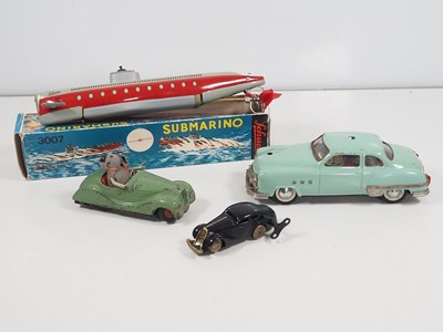 Lot 210 - A group of SCHUCO vintage tinplate vehicles...