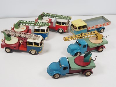 Lot 214 - A group of unboxed tinplate lorries by ITES...