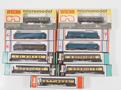 Lot 238 - A group of N gauge coaches and bogie vans by...