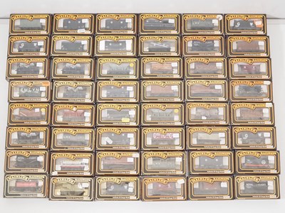 Lot 308 - A large group of MAINLINE boxed OO gauge...