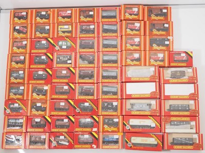 Lot 310 - A very large group of HORNBY boxed OO gauge...