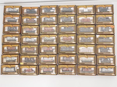 Lot 314 - A large group of MAINLINE boxed OO gauge...