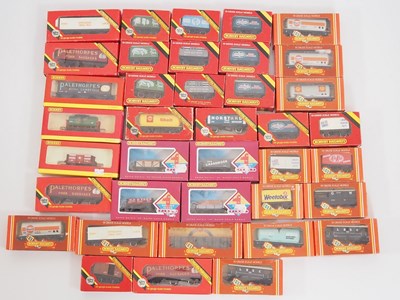 Lot 409 - A large group of HORNBY boxed OO gauge wagons...