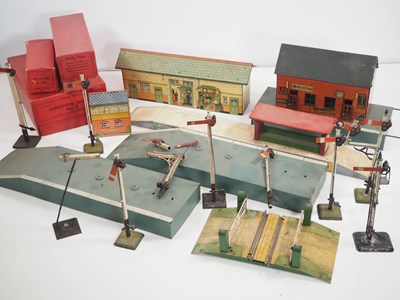 Lot 591 - A group of tinplate O gauge buildings, signals...