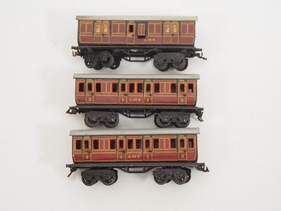 Lot 606 - A group of BING O gauge short bogie coaches in...