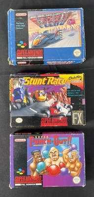 Lot 590 - SUPER NINTENDO (SNES) - A group of three boxed...