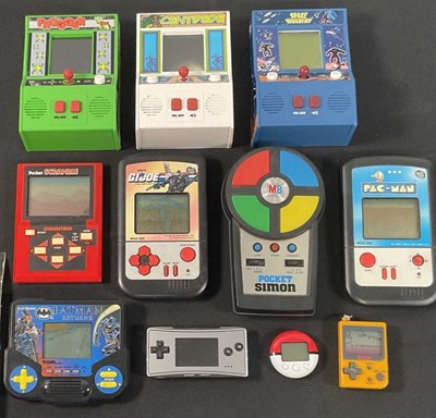 Lot 364 - A group of handheld, unboxed consoles to...