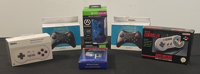 Lot 396 - CONTROLLERS - A group of boxed controllers for...