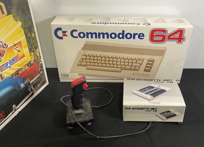 Lot 393 - COMMODORE - A boxed COMMODORE 64 and COMMODORE...