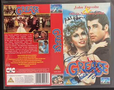 Lot 337 - A GREASE VHS sleeve signed by OLIVA NEWTON...