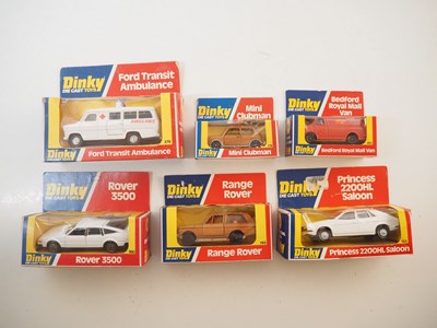 Lot 70 - A group of DINKY diecast cars and vans in late...