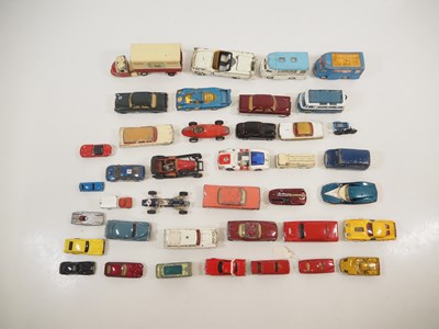 Lot 107 - A group of playworn diecast cars and vans by...