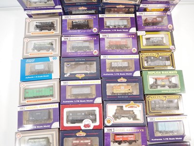 Lot 458 - A large group of OO gauge wagons by BACHMANN,...