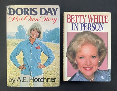 Lot 73 - A pair of hardback books signed by female...