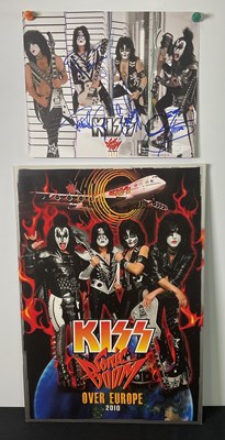 Lot 527 - A KISS 2010 Sonic Boom tour photo card signed...