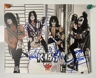 Lot 527 - A KISS 2010 Sonic Boom tour photo card signed...