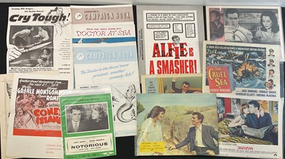 Lot 183 - A mixed group of lobby cards and pressbooks -...