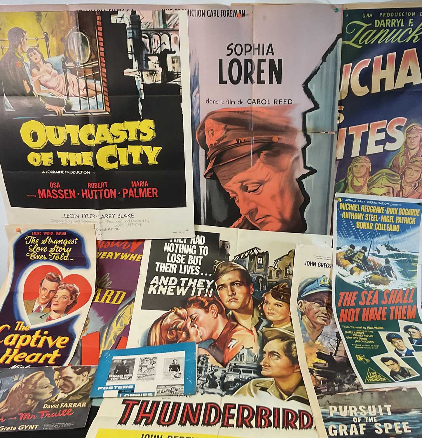 Lot 101 - A small group of war film posters comprising:...