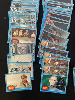 Lot 486 - A collection of 1977 STAR WARS Topps trading...