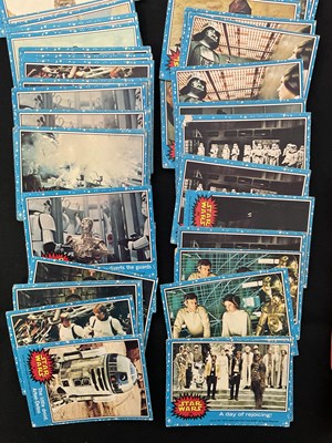 Lot 486 - A collection of 1977 STAR WARS Topps trading...