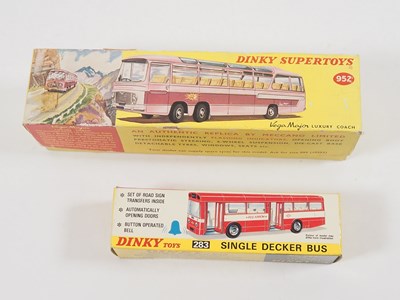 Lot 32 - A pair of boxed diecast buses comprising a...