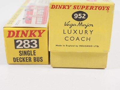Lot 32 - A pair of boxed diecast buses comprising a...
