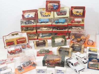 Lot 61 - A group of mixed mostly boxed diecast cars,...