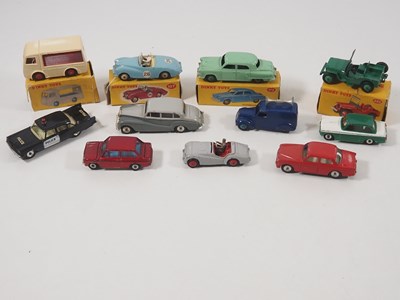 Lot 65 - A group of boxed and unboxed DINKY cars and...