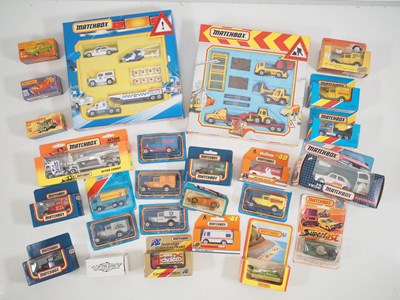 Lot 119 - A group of boxed and carded MATCHBOX vehicles...