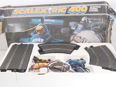 Lot 150 - A SCALEXTRIC 400 vintage slot racing set in...