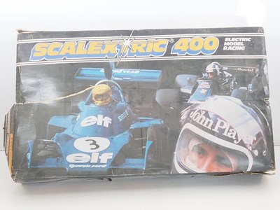 Lot 150 - A SCALEXTRIC 400 vintage slot racing set in...