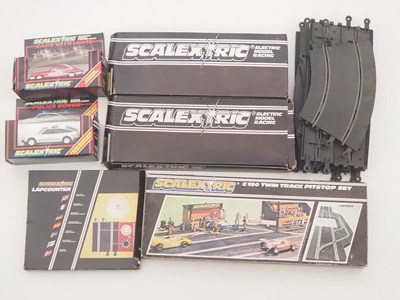 Lot 151 - A group of SCALEXTRIC track and accessories...