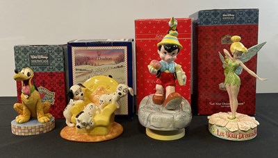 Lot 535 - A group of 4 Walt Disney ceramic figures...