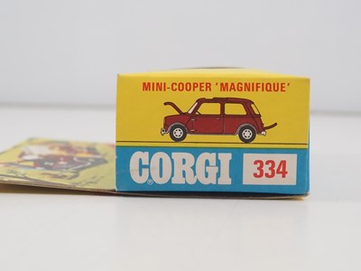 Lot 519 - A CORGI 334 diecast Mini-Cooper 'Magnifique'...