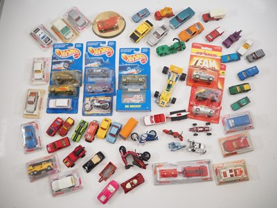 Lot 595 - A group of boxed and unboxed diecast cars to...