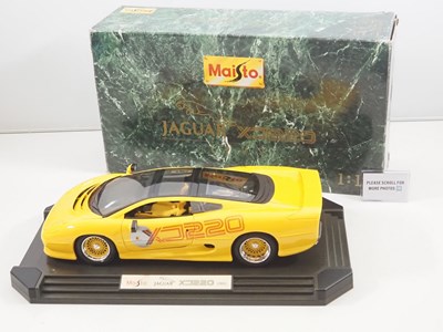Lot 630 - A MAISTO 1:12 scale diecast Jaguar XJ220 car...