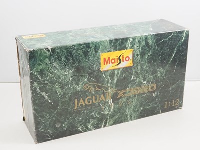 Lot 630 - A MAISTO 1:12 scale diecast Jaguar XJ220 car...