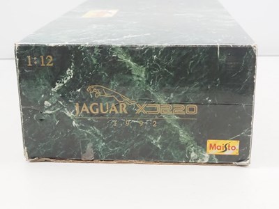 Lot 630 - A MAISTO 1:12 scale diecast Jaguar XJ220 car...