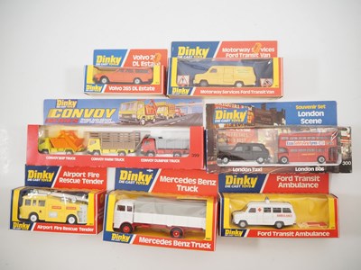 Lot 697 - A group of DINKY diecast cars, vans and...