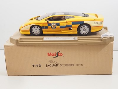 Lot 747 - A pair of MAISTO 1:12 scale diecast Jaguar...