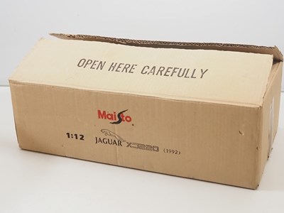 Lot 747 - A pair of MAISTO 1:12 scale diecast Jaguar...