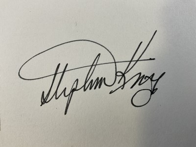 Lot 431 - STEPHEN KING - An autograph card signed by the...